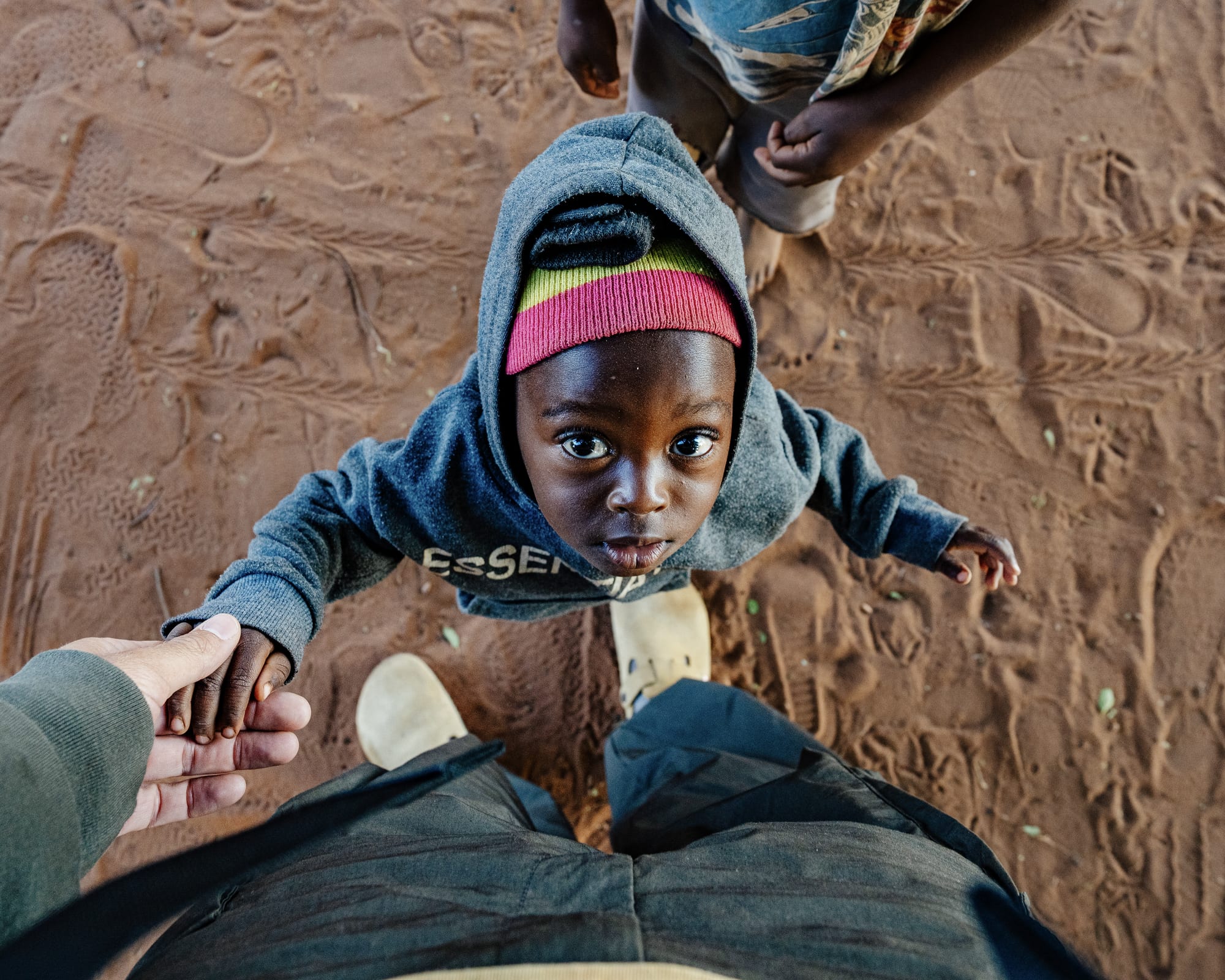 A boy in a hoodie laughing, Southern Africa