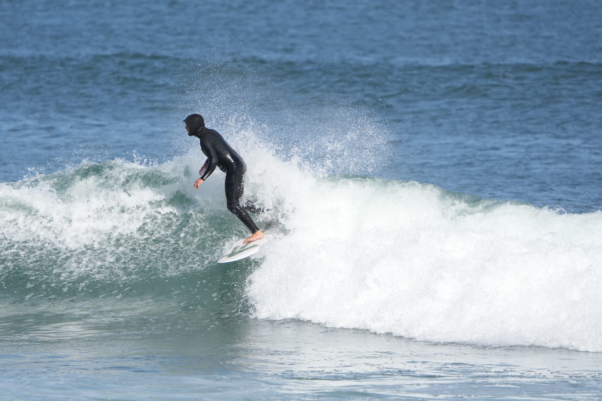 Clean bottom turn on a green wall