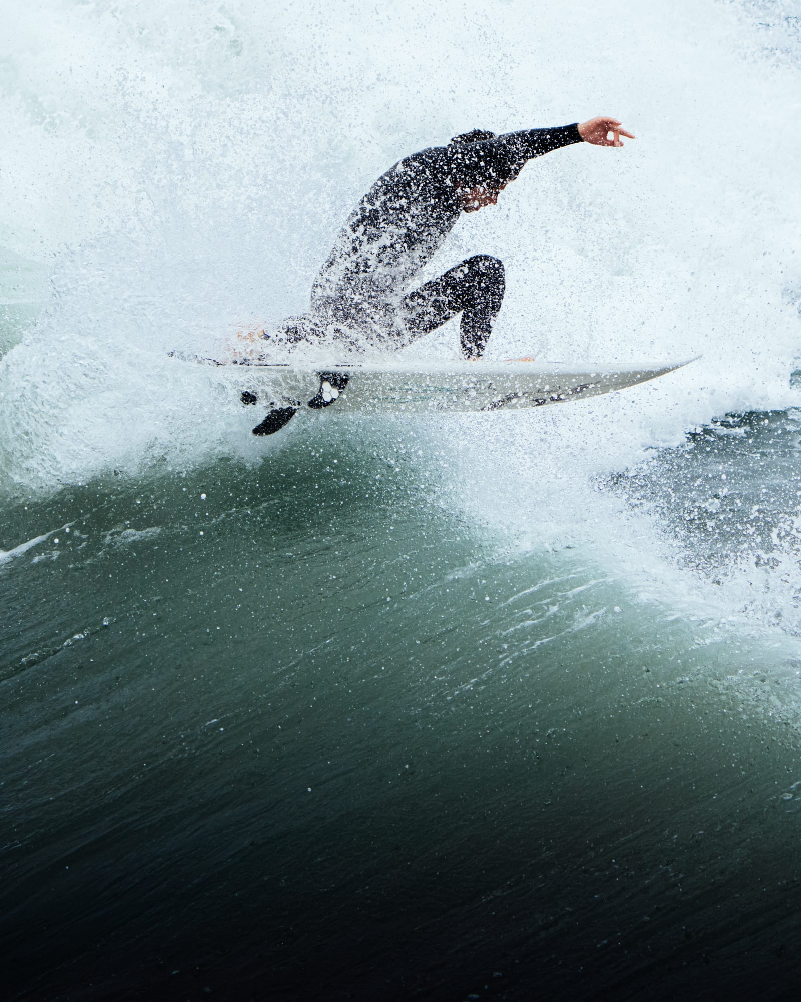 Surfer kicking out through the whitewater