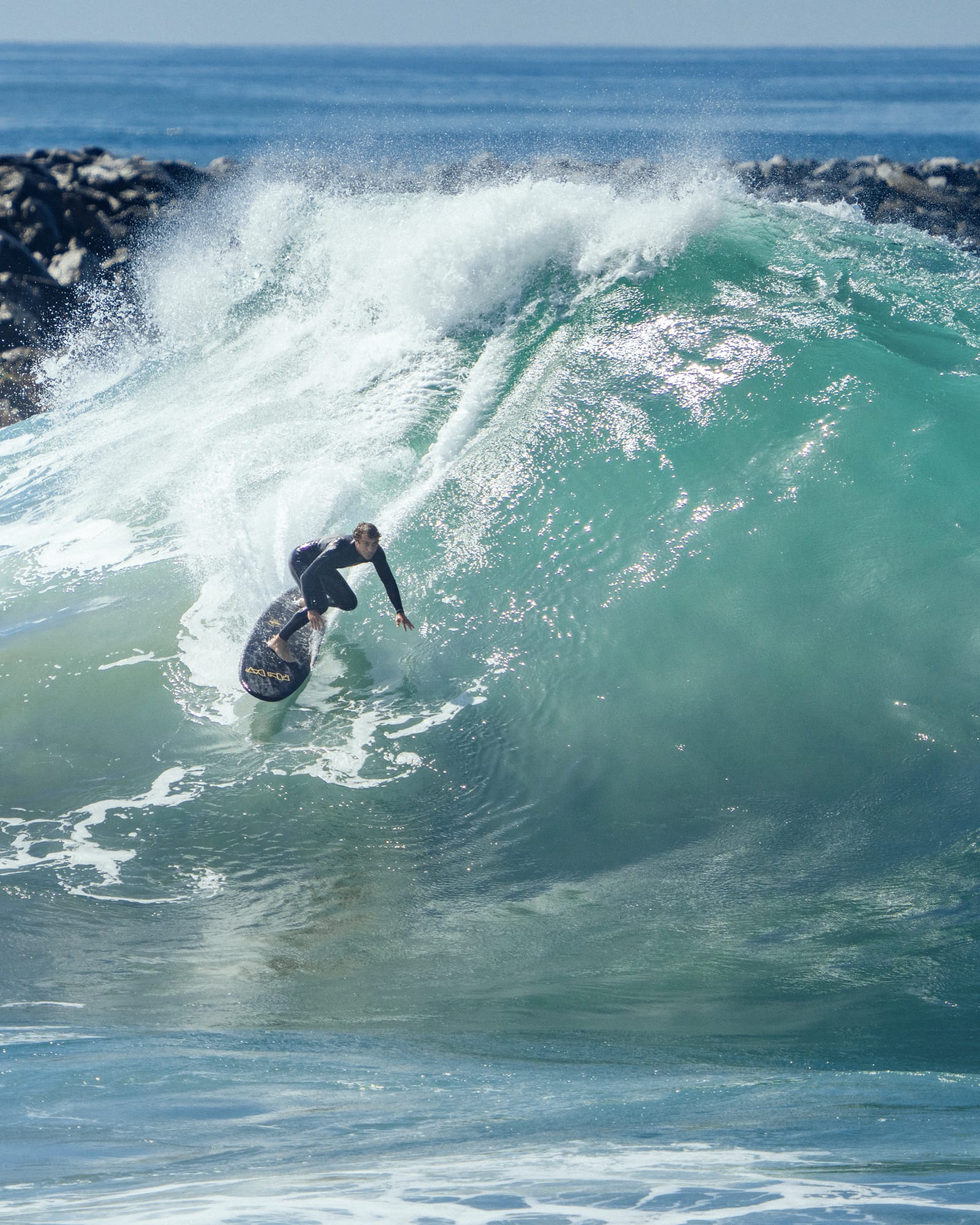 Surfer inside a glowing green wave